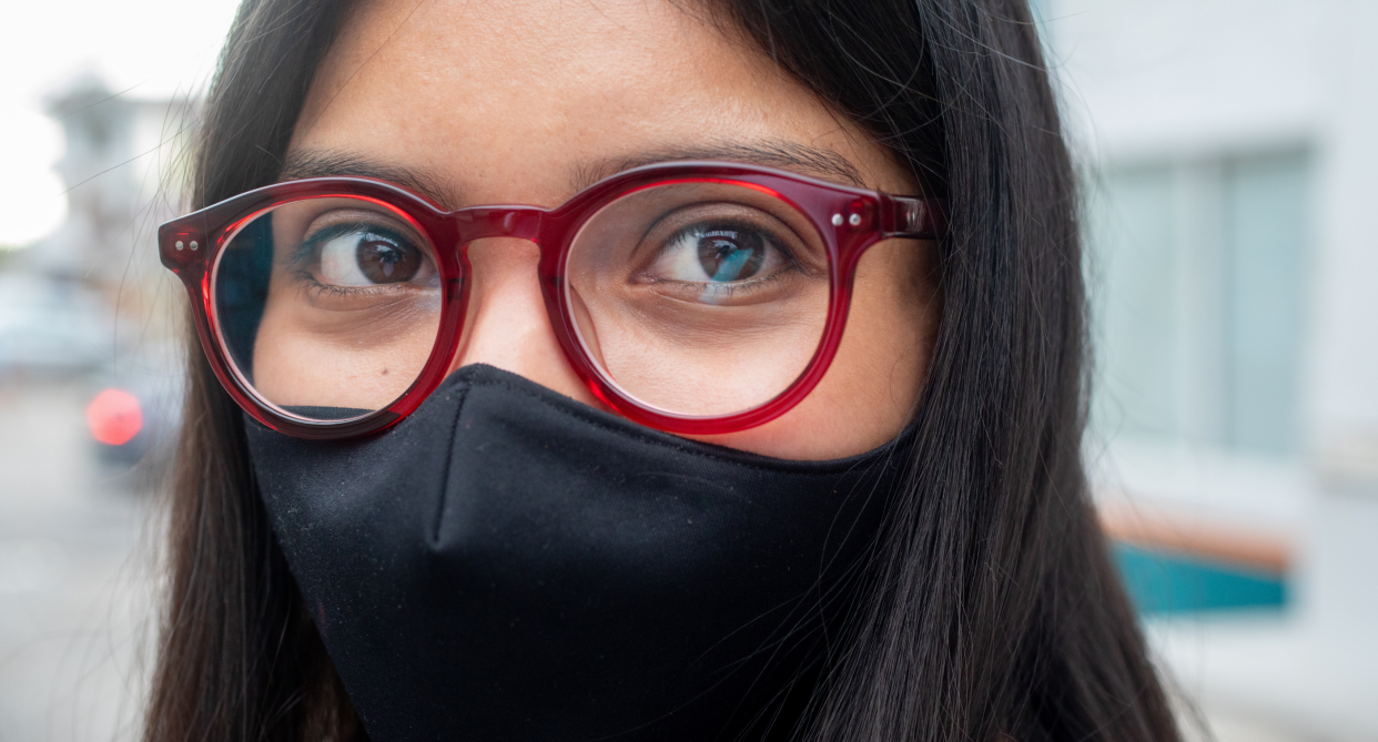 woman in red glasses and black face mask, If you wear glasses, Amazon reviewers swear by these face masks (Photo via Amazon)