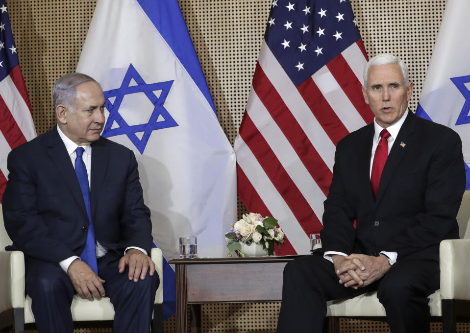 United States Vice President Mike Pence, right, talks to the media during a bilateral meeting with Israeli Prime Minister Benjamin Netanyahu, left, in Warsaw, Poland, Thursday, Feb. 14, 2019. The Polish capital is host for a two-day international conference on the Middle East, co-organized by Poland and the United States. (AP Photo/Michael Sohn)