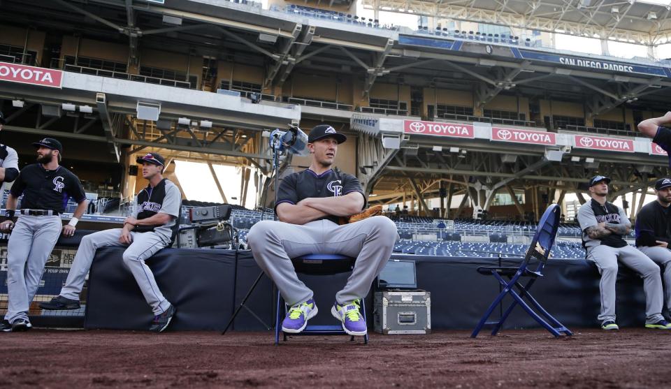 Colorado Rockies shortstop Troy Tulowitzki relaxes o[n a chair while awaiting batting practice and other pre game activities at the MLB National League baseball game against the San Diego Padres Tuesday, April 15, 2014, in San Diego. (AP Photo/Lenny Ignelzi)