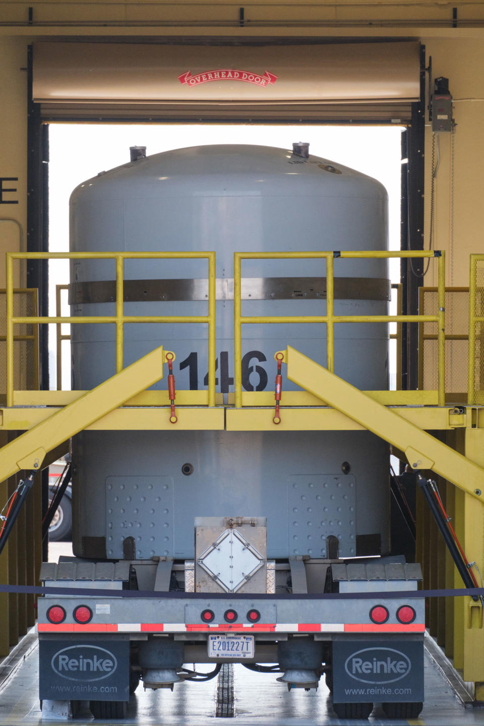 Radioactive waste transportation containers are loaded onto the beds of semi-trucks at the Radioassay and Nondestructive Testing Facility.<span class="copyright">Ramsay de Give for TIME</span>