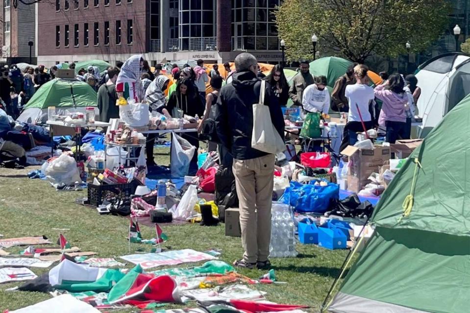 Students walk the lawn at Columbia University on Monday.