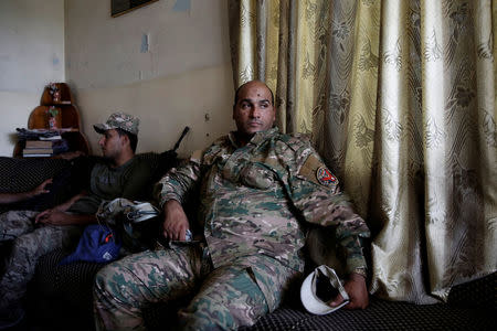 A member of Iraqi rapid response forces rests in a house used as outpost during clashes with Islamic State fighters in western Mosul. REUTERS/Alkis Konstantinidis