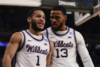 Kansas State's Markquis Nowell (1) and Taj Manning (15) react in the first half of an Elite 8 college basketball game against Florida Atlantic in the NCAA Tournament's East Region final, Saturday, March 25, 2023, in New York. (AP Photo/Adam Hunger)