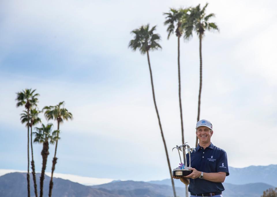 PGA TOUR Champions player David Toms holds up the Galleri Classic trophy after winning the inaugural playing of the tournament on the Dinah Shore Tournament Course in Rancho Mirage, Calif., Sunday, March 26, 2023. Toms finished 16-under overall after hitting 7-under for the final round. 