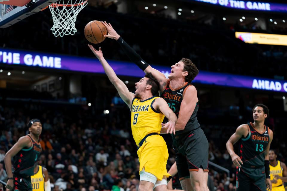 Wizards center Mike Muscala blocks a shot by Pacers guard T.J. McConnell, Dec. 15, 2023, in Washington.