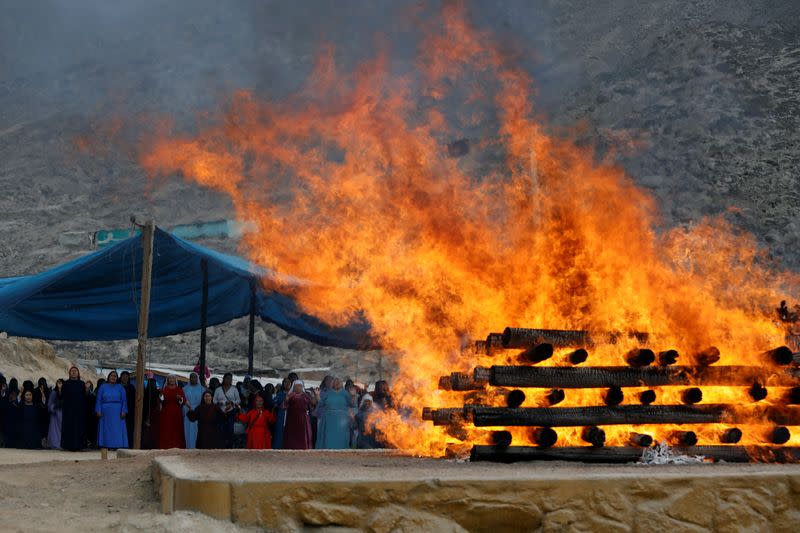 Female members of the Christian evangelical church Israelite Mission of the New Universal Pact attend a ritual burning of animal meat the church calls The Holocaust at the group's main temple, on the outskirts of Lima