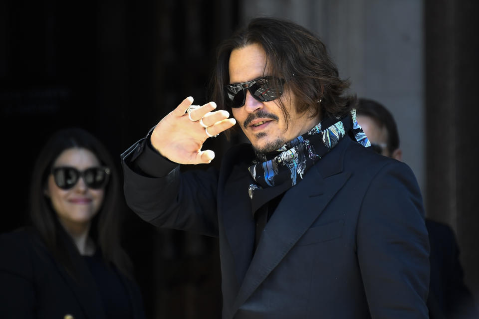 Actor Johnny Depp arrives at the High Court, in London, Monday, July 20, 2020. Amber Heard started Monday to give evidence at the High Court in London as part of Johnny Depp’s libel case against The Sun over allegations of domestic violence during the couple's relationship. (AP Photo/Alberto Pezzali)