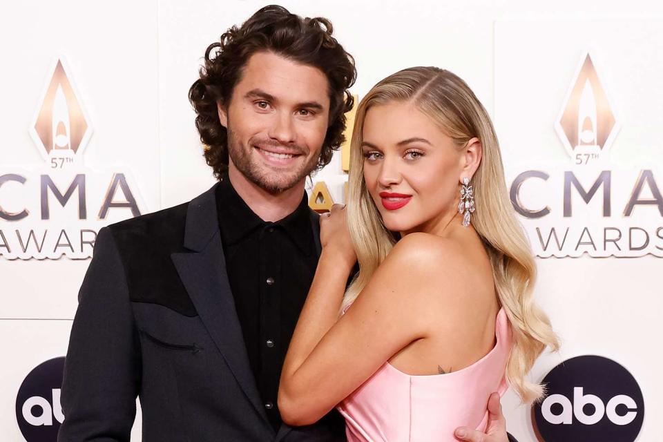 <p>Taylor Hill/WireImage</p> Chase Stokes and Kelsea Ballerini attend the 2023 CMA Awards on Nov. 8, 2023 in Nashville