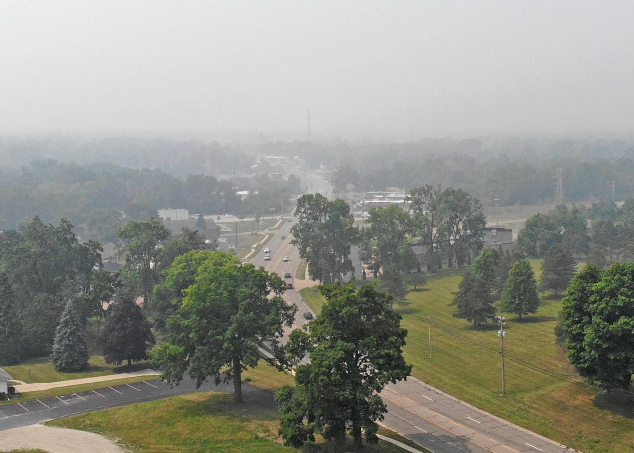Smoke from Canadian wildfires is seen Thursday in an aerial photo taken from the Lenawee Intermediate School District Tech Center campus looking toward downtown Adrian. The old Lenawee County Courthouse dome is barely visible.