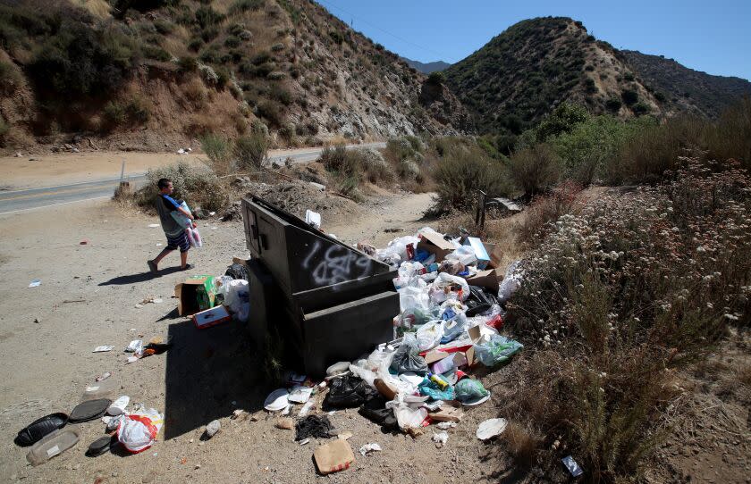 San Gabriel Mountains National Monument, CA - July 26: Trash and graffiti pile-up along the East Fork of the San Gabriel River in the San Gabriel Mountains National Monument in the Angeles National Forest Wednesday, July 26, 2023. Volunteers who attempt to clean it up refer to it as "the east fork toilet." (Allen J. Schaben / Los Angeles Times)