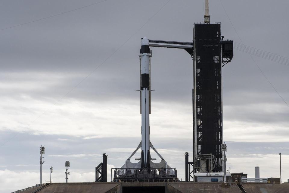 A SpaceX Falcon 9 rocket, with the company’s Dragon cargo spacecraft atop, is raised to a vertical position at NASA Kennedy Space Center’s Launch Complex 39A in preparation for a commercial resupply services launch to the International Space Station.