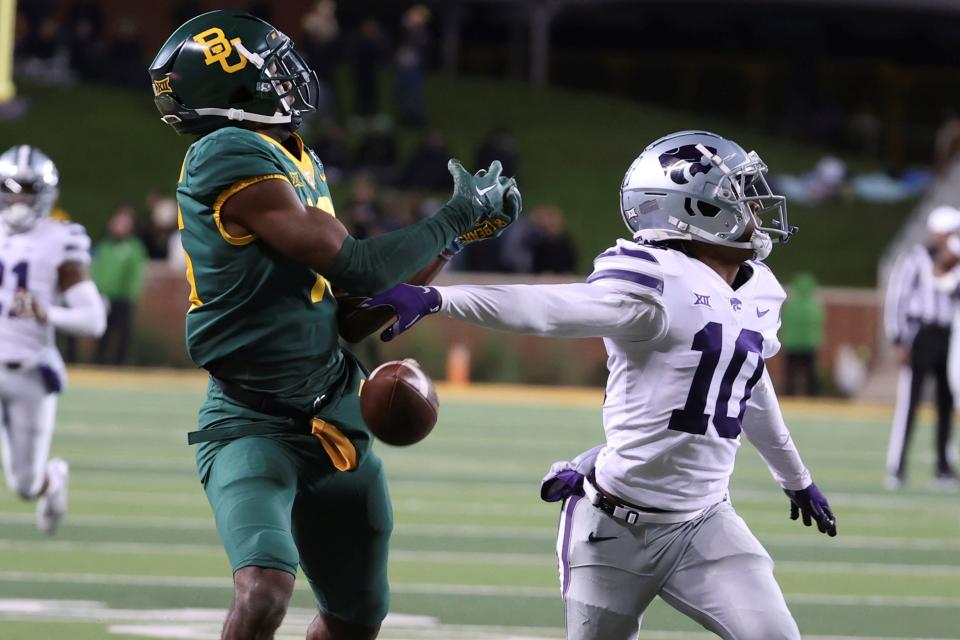 Kansas State cornerback Jacob Parris (10) breaks up a pass intended for Baylor's Tripp Mitchell during their game last season in Waco, Texas.