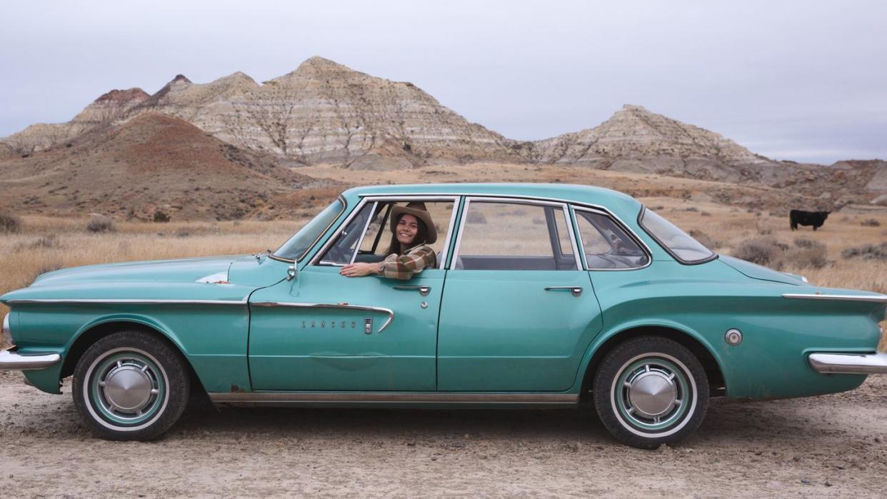 a person sitting in a car