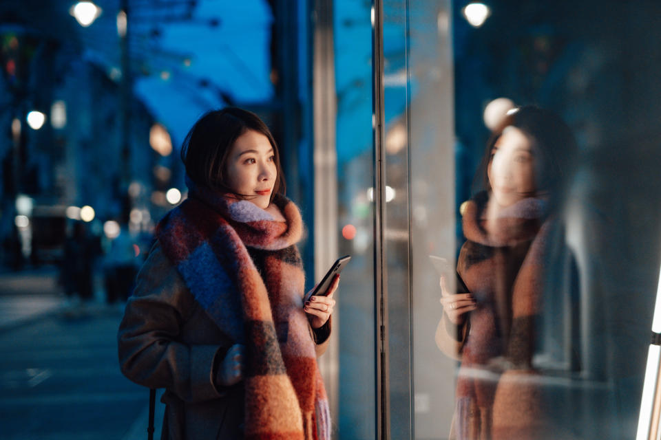 A woman looking in a window display