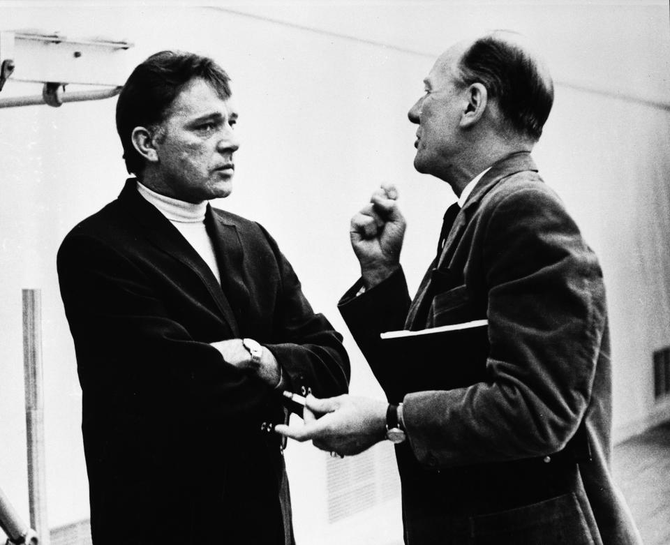 (Original Caption) Welsh actor, Richard Burton (left), listens intently as he takes direction from director, John Gielgud, during rehearsal of Burton’s Broadway-bound production of “Hamlet,” at the O’Keefe Center.