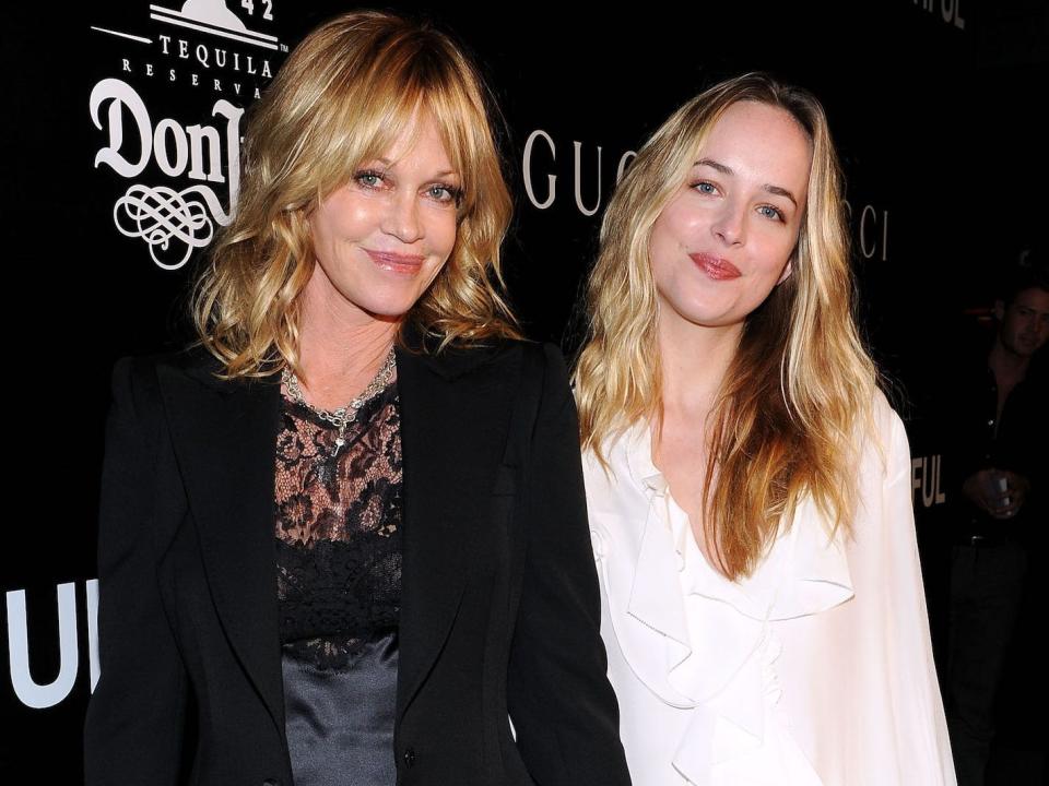 Melanie Griffith and Dakota Johnson on a red carpet in 2010.