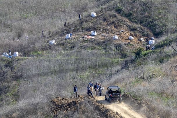 PHOTO: Investigators work at the scene of the helicopter crash, where former NBA star Kobe Bryant and his 13-year-old daughter Gianna died, Jan. 28, 2020, in Calabasas, Calif. (David Mcnew/Getty Images, FILE)