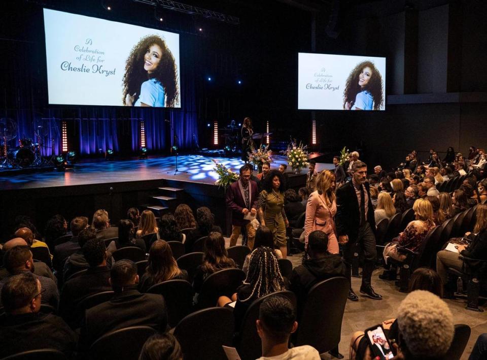 The family of Cheslie Kryst, center, are escorted after the memorial service to honor her life at Elevation Blakeney February 18, 2022 in Charlotte.