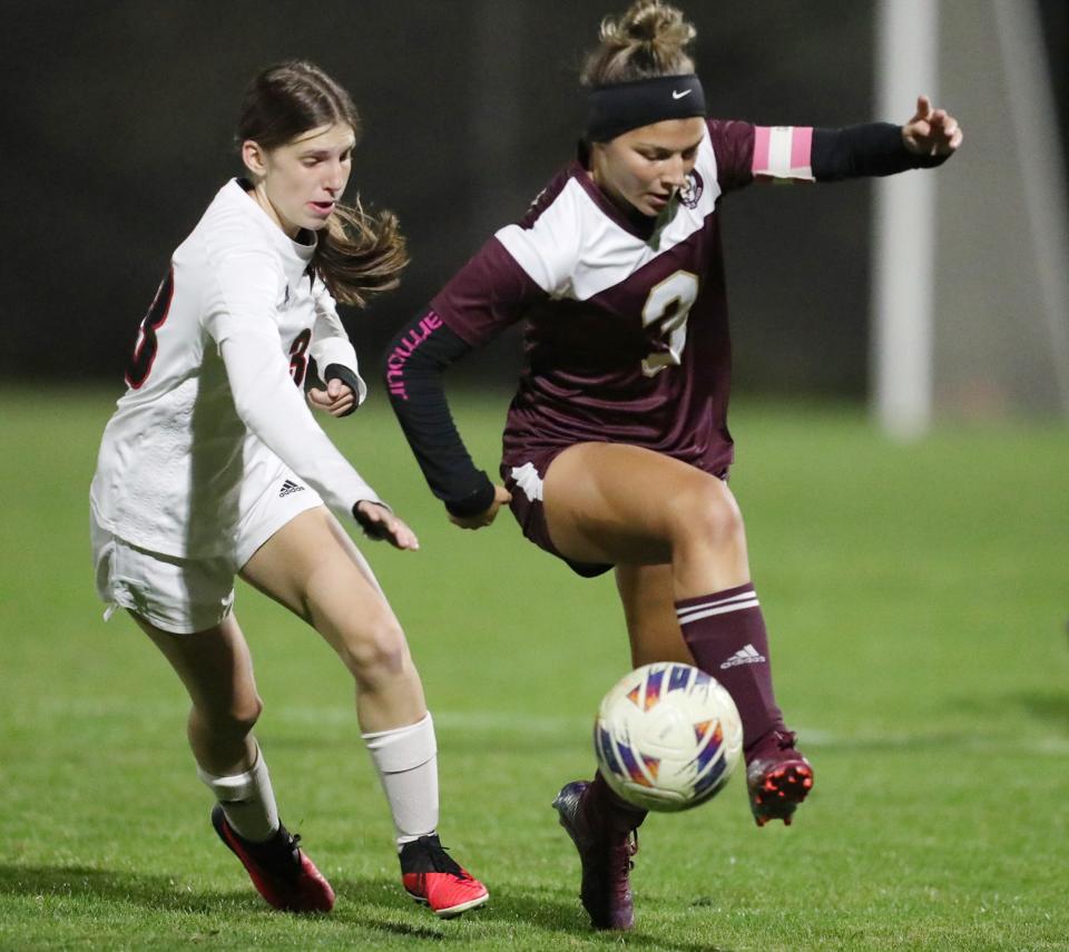 Manchester's Marissa Gehm goes after the ball as Stow's Paityn Marino tries to control it, Oct. 9, 2023.