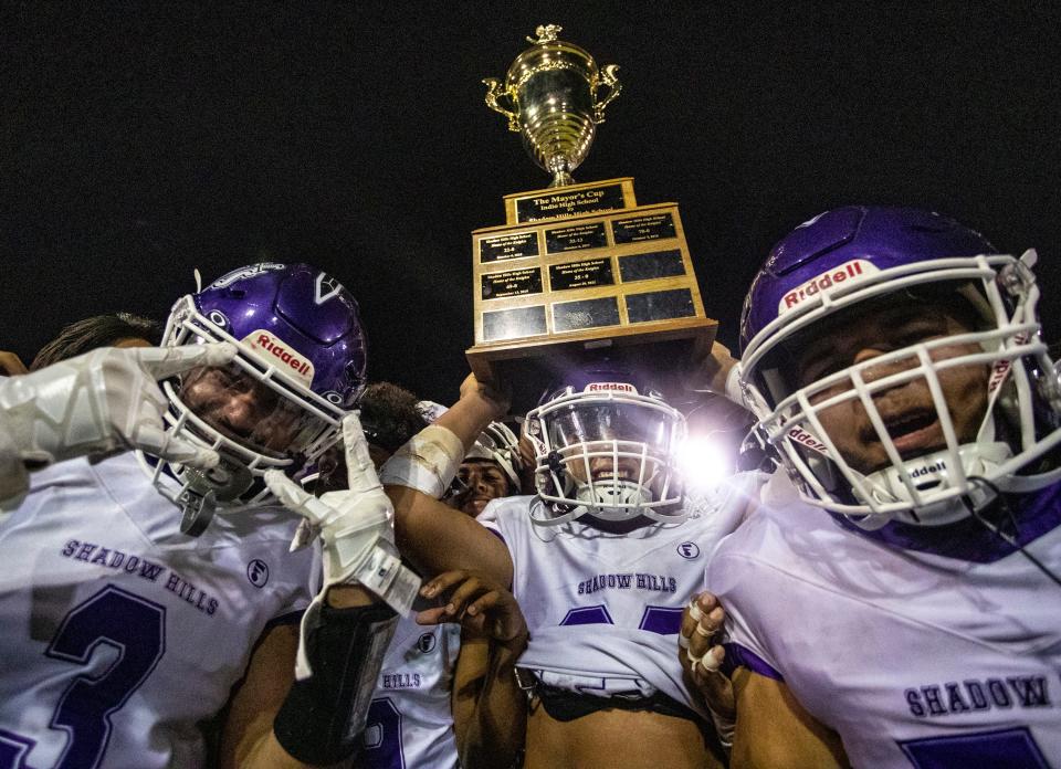 Shadow Hills players pose with the MayorÕs Cup trophy after beating Indio 28-13 at Indio High School in Indio, Calif., Friday, Aug. 19, 2022. 