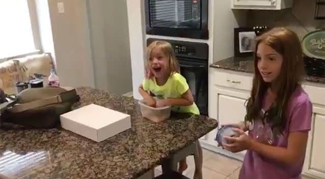 'Are you kidding me': Parents surprise daughters with a new adopted sister