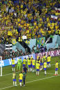 Brazil's players celebrate at the end of the World Cup group G soccer match between Brazil and Switzerland, at the Stadium 974 in Doha, Qatar, Monday, Nov. 28, 2022. (AP Photo/Darko Bandic)