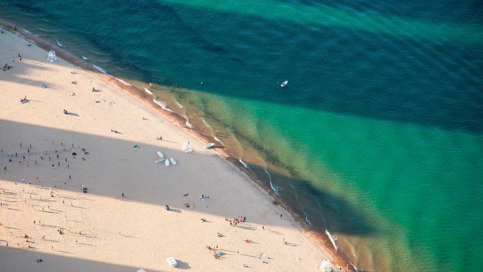View of oak street beach with small boats in back ground, John Hancock Center, Michigan Lake - Chicago.