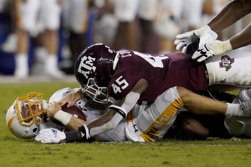 Texas A&M linebacker Edgerrin Cooper (45) sacks Kent State quarterback Dustin Crum (7) during the fourth quarter of an NCAA college football game on Saturday, Sept. 4, 2021, in College Station, Texas. (AP Photo/Sam Craft)