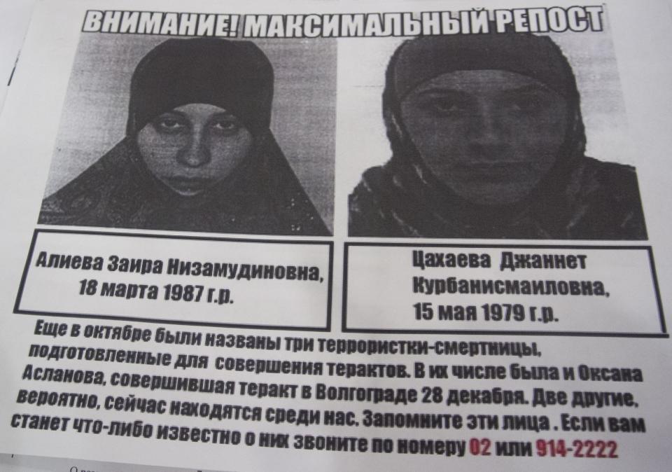 A photo of a police leaflet seen in a Sochi hotel on Tuesday, Jan. 21, 2014, depicting Dzhannet Tsakhayeva, right, and Zaira Aliyeva. Russian security officials are hunting down three potential female suicide bombers, one of whom is believed to be in Sochi, where the Winter Olympics will begin next month. Police leaflets seen by an Associated Press reporter at a central Sochi hotel on Tuesday contain warnings about three potential suicide bombers. The police leaflet reads: "Please remember those faces, terrorists may be among us now. If you happen to know anything about them please call 02....". (AP Photo/Natalya Vasilyeva)