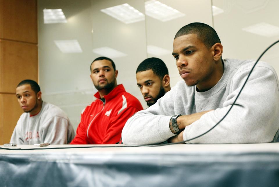 Ohio State football players (from left) DeVier Posey, Mike Adams, Dan Herron and Terrelle Pryor were suspended by the NCAA in 2010 for selling rings, jerseys and awards and receiving improper benefits from a tattoo parlor.