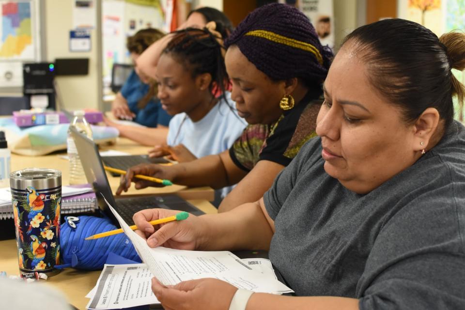 Students at the DORS High School adult education program study for upcoming tests. (Christel House)