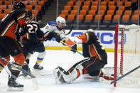 St. Louis Blues left wing Zach Sanford, center, scores past Anaheim Ducks goaltender John Gibson during the third period of an NHL hockey game Wednesday, March 3, 2021, in Anaheim, Calif. (AP Photo/Marcio Jose Sanchez)