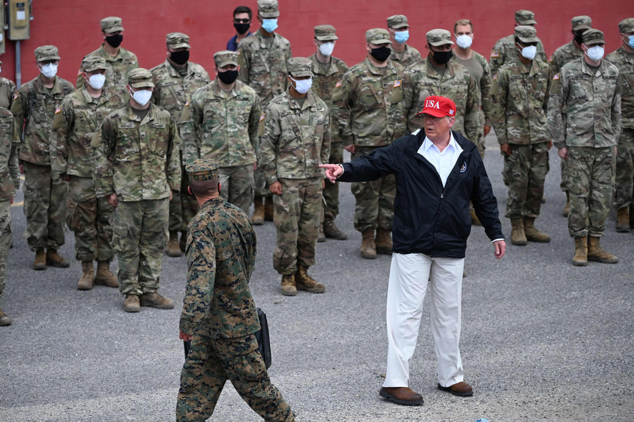 President Donald Trump poses with National Guard troops in Lake Charles, La., on Aug. 29, 2020.