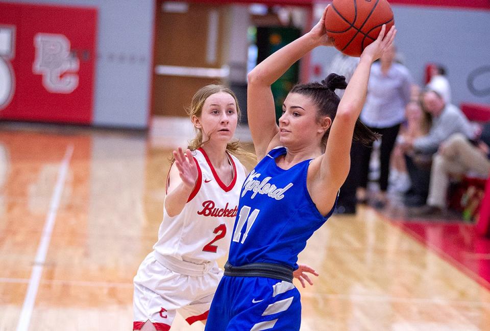 Buckeye Central's Kate Siesel puts pressure on Wynford's Reese McGuire.