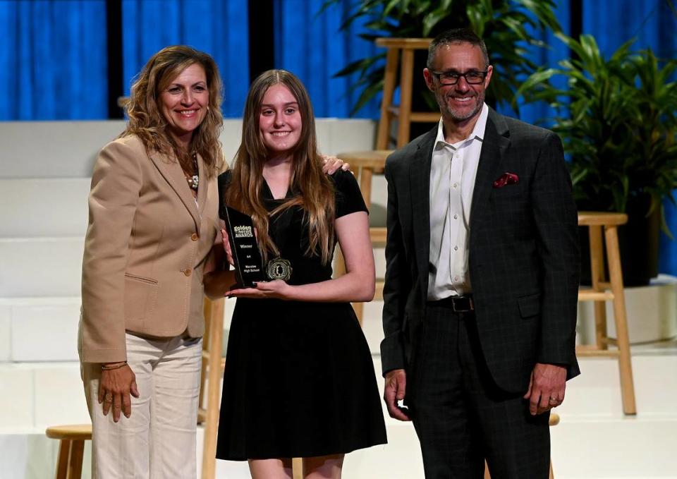 2023 Golden Herald Award winner in Art, Hana Kaffka with presenters Jackie Barron and Tom McDougal Thursday night.