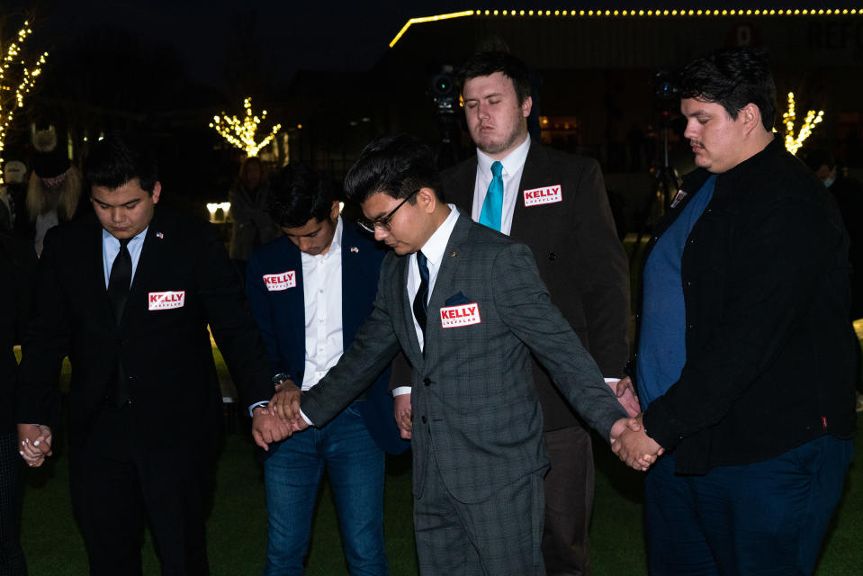 <strong>Canton, Ga., Jan. 3, 2021.</strong> Young Republicans pray at a rally for Senate candidate Kelly Loeffler.<span class="copyright">Peter van Agtmael—Magnum Photos for TIME</span>