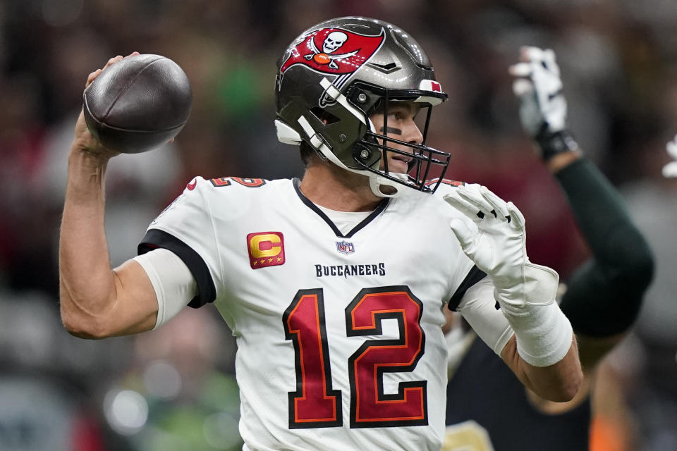 Tampa Bay Buccaneers quarterback Tom Brady passes against the New Orleans Saints during the first half of an NFL football game in New Orleans, Sunday, Sept. 18, 2022. (AP Photo/Gerald Herbert)