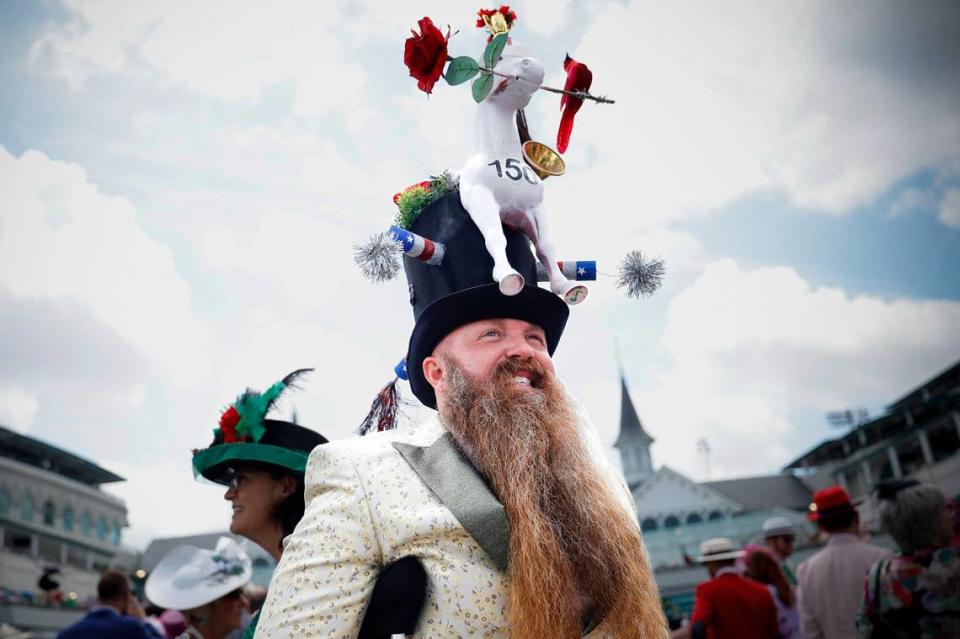 Garey Faulkner of Cincinnati stands near the paddock early in the day before the 150th running of the Kentucky Derby at Churchill Downs on Saturday.