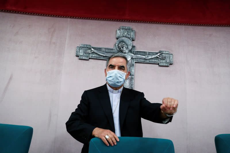 Cardinal Giovanni Angelo Becciu speaks to the media in Rome