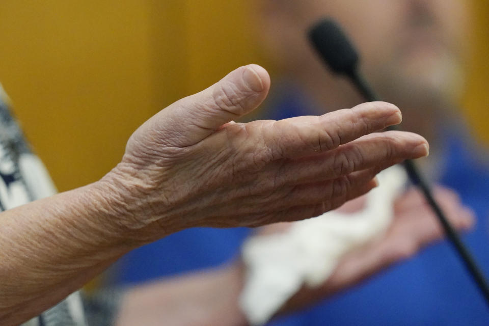 Vicki Moak, mother of slain Brookhaven Police Department Cpl. Zach Moak, gestures as she speaks directly to her son's admitted killer, Marquis Aaron Flowers, in the Lincoln County Circuit Court, moments after he plead guilty to first degree murder in the 2018 shooting deaths of two Brookhaven police officers including Moak, Wednesday, Nov. 3, 2021, in Brookhaven, Miss. Members of the officers' families addressed the court in emotional statements, asking for the maximum sentences to be imposed. (AP Photo/Rogelio V. Solis)