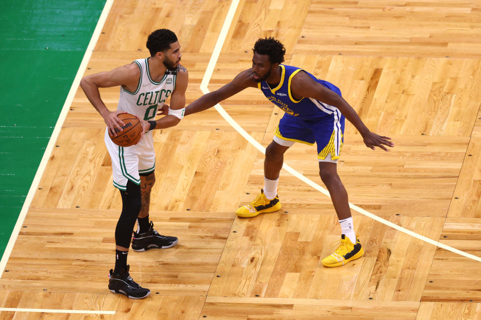 BOSTON, MASSACHUSETTS - JUNE 16: Jayson Tatum #0 of the Boston Celtics is defended by Andrew Wiggins #22 of the Golden State Warriors during the first quarterin Game Six of the 2022 NBA Finals at TD Garden on June 16, 2022 in Boston, Massachusetts. NOTE TO USER: User expressly acknowledges and agrees that, by downloading and/or using this photograph, User is consenting to the terms and conditions of the Getty Images License Agreement. (Photo by Adam Glanzman/Getty Images)