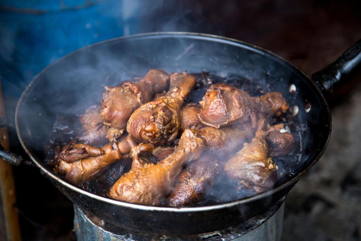 Jerk chicken in a pan.