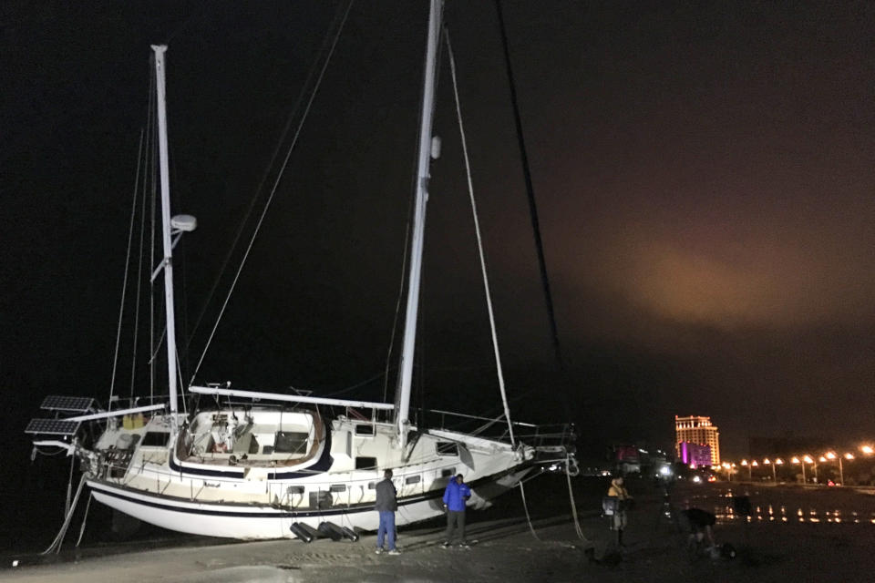 <p>A sailboat is washed up on the beach in Biloxi, Miss., early Sunday, Oct. 8, 2017, after Hurricane Nate came ashore on the Mississippi Gulf Coast. Hurricane Nate brought flooding and power outages to the Gulf Coast as it sloshed ashore outside Biloxi early Sunday, the first hurricane to make landfall in Mississippi since Hurricane Katrina in 2005. (Photo: Jeff Amy/AP) </p>