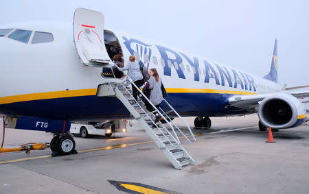 Passengers board a Ryanair flight at Stansted Airport, Britain, October 12, 2017. Picture taken October 12, 2017 REUTERS/Hannah McKay