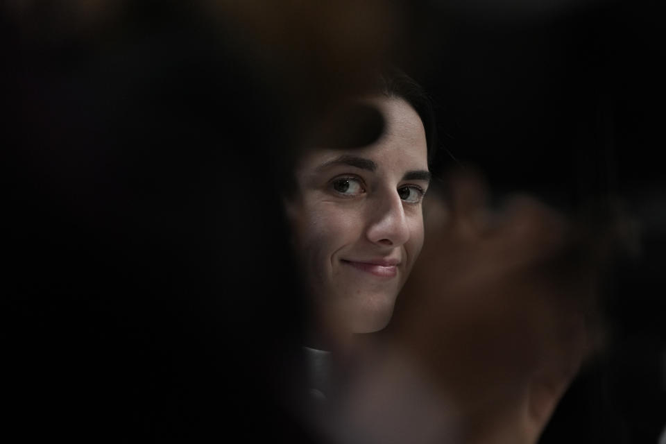 Iowa's Caitlin Clark looks on during a news conference announcing the AP NCAA Women's Coach and Player of the Year Thursday, April 4, 2024, in Cleveland. (AP Photo/Carolyn Kaster)