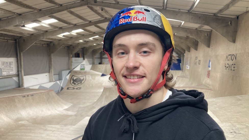 Kieran Reilly wearing a helmet and sitting on this bike