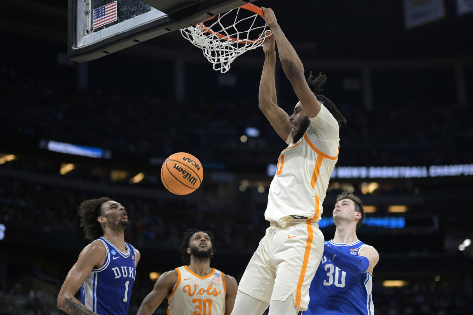 Tennessee forward Jonas Aidoo (0) dunks as guard Josiah-Jordan James (30) and Duke center Dereck Lively II (1) and center Kyle Filipowski (30) watch during the first half of a second-round college basketball game in the NCAA Tournament, Saturday, March 18, 2023, in Orlando, Fla. (AP Photo/Phelan M. Ebenhack)