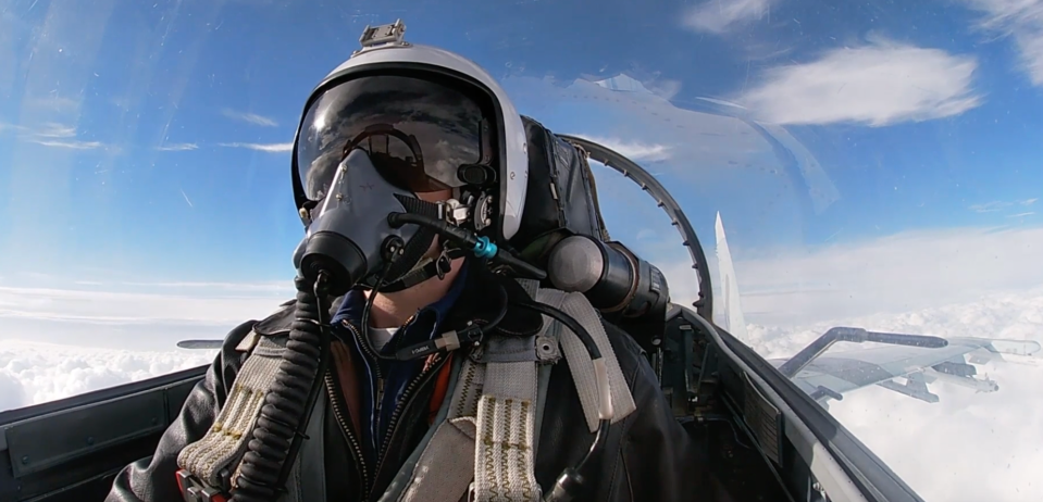 A screencap of a Su-27 combat air patrol from a Russian Ministry of Defense video. Note that the pilot is not equipped with a helmet-mounted sight. <em>Zvezda TV</em> <em>screencap</em>