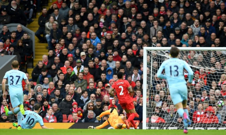 Burnley's striker Ashley Barnes (2nd L) watches as his shot hits the back of the Liverpool net for the opening goal of the English Premier League football match between Liverpool and Burnley on March 12, 2017