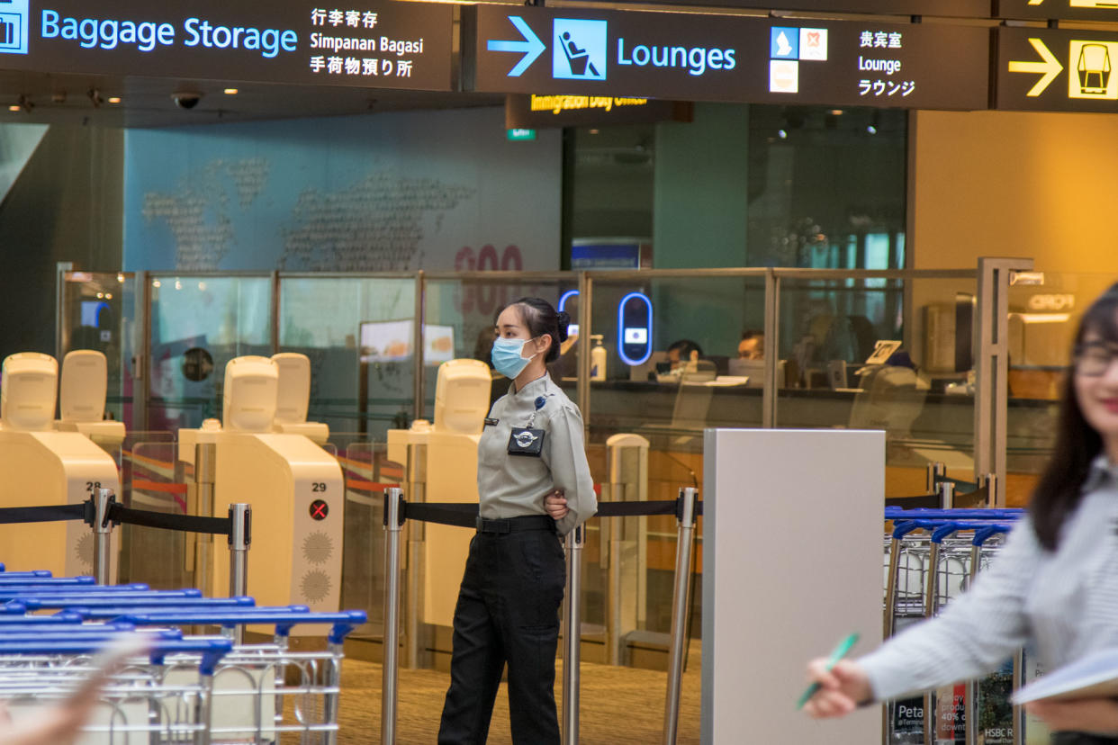 A security officer at Changi Airport's Terminal 3 seen wearing a face mask on 6 February 2020. (PHOTO: Dhany Osman / Yahoo News Singapore)